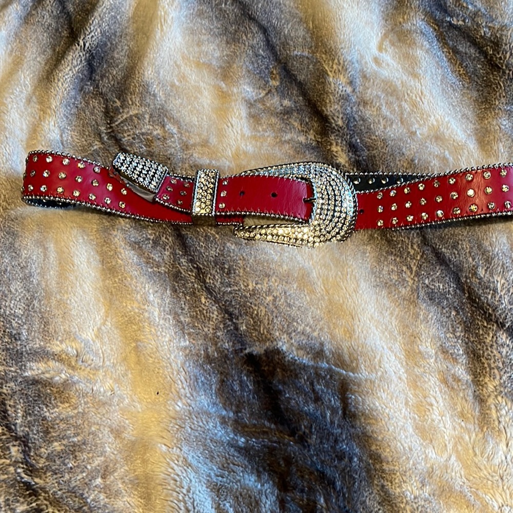 Red bling belt. Leather. Great condition. Belt is about 38” long.